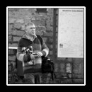 In front of Hotel Castel Dracula (with map of the Călimani Mountains on the right)