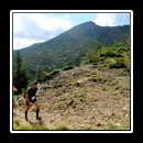 Marathon runners arriving at the checkpoint, with the Pietrosul Peak (2,102 m high) in the background. 